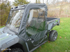 Close-up of the 3 Star full cab enclosure soft door and top on a gray Arctic Cat Prowler Pro, side view