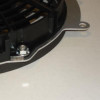 Close-up of the mounting tab and bolt on the Universal Parts Kawasaki Teryx 750 fan shroud