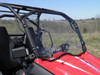 Angled passenger-side view of the 3 Star windshield on the CFMoto ZForce with the rubber edge seal along the hood