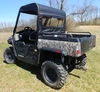 Rear three-quarter view of the 3 Star vinyl top and rear window on the camo Hisun Sector, passenger side
