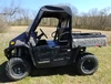 Side profile of the camo Hisun Sector 550/750 with the 3 Star black vinyl top and rear window in a grassy field