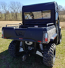 3 Star soft back panel with clear window installed behind the cab of a camo Hisun Sector 550/750, rear view