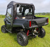 Rear view of a Honda Pioneer 700-2 showing the 3 Star enclosure rear window above the bed