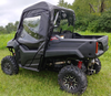 Rear three-quarter view of a gray Honda Pioneer 700-2 with the 3 Star cab enclosure doors and top