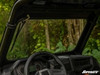 View from the driver seat through the SuperATV glass windshield on a Polaris RZR XP Turbo toward trees