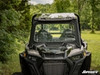 Front view of a Polaris RZR XP Turbo with the SuperATV glass windshield and roof in a wooded setting