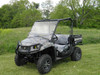 3 Star 2-piece windshield installed on a camo John Deere Gator, front three-quarter view in a grass field