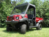 Front three-quarter view of a red Kawasaki Mule 4010 with the 3 Star black vinyl top and clear windshield