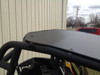 Rear view of the EMP aluminum top on the Can-Am Maverick cage showing the rear edge and mounting bolts