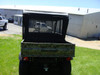 Rear view of a camo Kawasaki Mule 610 with the 3 Star black vinyl top installed, mesh cargo screen behind the seats