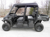 Driver side profile of a black Kawasaki Mule Pro with the 3 Star vinyl top over the front cab, rear seats open