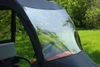 Close-up of the clear 3 Star vinyl windshield panel and black top edge on an orange Kubota utility vehicle