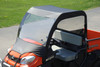 3 Star vinyl windshield and top installed on an orange Kubota utility vehicle, angled view from the front corner