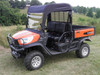 3 Star vinyl windshield, top and rear window combo on an orange Kubota RTV-X1120, front three-quarter view