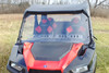 Front view of the 3 Star one-piece scratch-resistant windshield with vent slots on a red Polaris General Crew