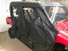Greene Mountain soft doors and roof on a Yamaha Viking VI parked in a garage, front quarter view