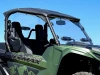 Spike windshield for Yamaha Wolverine RMAX: vented windshield on a green Yamaha RMAX, side close-up