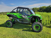 3 Star full cab enclosure on a green Kawasaki KRX, black cab with clear windows, side view in a field