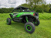Green Kawasaki KRX under a cloudy sky with the 3 Star soft top fitted, rear three-quarter view
