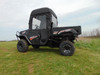 Side view of the black Kubota RTV XG850 with the 3 Star vinyl windshield and soft doors installed