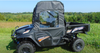 Side view of the 3 Star soft doors with clear windows on a dark blue Kubota RTV XG850 in a field