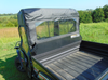 Rear three-quarter view of the Kubota RTV XG850 with the 3 Star soft back panel behind the roll cage and empty bed