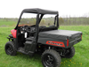 Rear three-quarter view of a red Polaris Ranger 570 midsize with the 3 Star vinyl top, rear window and a bed cover