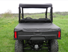 Rear view of a Polaris Ranger 570 MidSize with the 3 Star soft top above the bench seat and bed cover