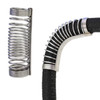 Moto Alliance Unicoil shown loose as a bare steel coil spring and fitted over a curved black heater hose