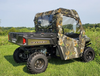Wider rear three-quarter view of the Polaris Ranger 570 with the 3 Star camo doors and rear window in a field