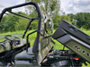 Driver side view of the camo 3 Star rear window on a Polaris Ranger 570-3 with the cargo bed tilted up