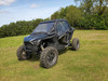 3 Star black soft upper doors on a black Polaris RZR Pro XP, rear 3/4 view on grass
