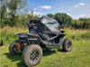 Rear three-quarter view of a black CFMoto ZForce 950 with the 3 Star upper doors kit installed in a field