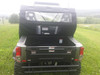 Straight rear view over the cargo bed of the Massimo MSU 800 LT showing the Side X Side enclosure rear window
