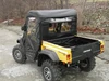 Passenger side rear three-quarter view of the yellow Cub Cadet Challenger with the 3 Star enclosure installed