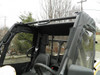 View across the cab of a yellow Cub Cadet Challenger showing the 3 Star soft door with clear window from the inside