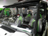 Angled close-up of the 3 Star windshield on the Kawasaki Teryx 750 showing the clamps on the roll cage tubes