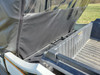 Close-up of the 3 Star rear window panel behind the cab of a Kawasaki Teryx 800, seen from the cargo bed