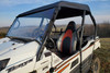 3 Star black soft top on a white Kawasaki Teryx, close side view outdoors