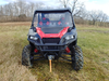 3 Star black soft top installed on a red Polaris General Crew, straight front view in a winter field
