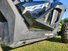 Close-up of the 3 Star lower door insert on the driver door of a black Polaris RZR, panel filling the gap below the window