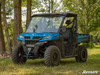Blue CF Moto U-Force 1000 fitted with SuperATV high clearance A-arms, front three-quarter view under trees