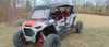 3 Star black soft top on a red and white RZR XP 4 Turbo S, front three-quarter view in a winter field, wide crop