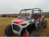 Front three-quarter view of a gray and red Polaris RZR XP 4 Turbo S with the 3 Star one-piece windshield