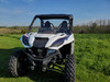 Front view of a white Wolverine RMAX2 with the 3 Star soft top installed, slightly angled from the front