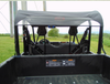 Rear view of the black 3 Star soft top over the Arctic Cat Stampede cage seen from the cargo bed