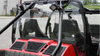Rear view of the 3 Star Lexan back panel on a red Arctic Cat Wildcat 4 showing the engine vent grilles