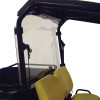 Rear three-quarter view of the Kolpin rear window clamped to the cab frame of the John Deere behind the yellow seat