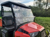Passenger side close view of the 3 Star 2-piece windshield vented lower panel on a red Coleman 400