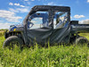 Side view of a blue Polaris Ranger 1000 Crew with the 3 Star full cab enclosure doors zipped closed